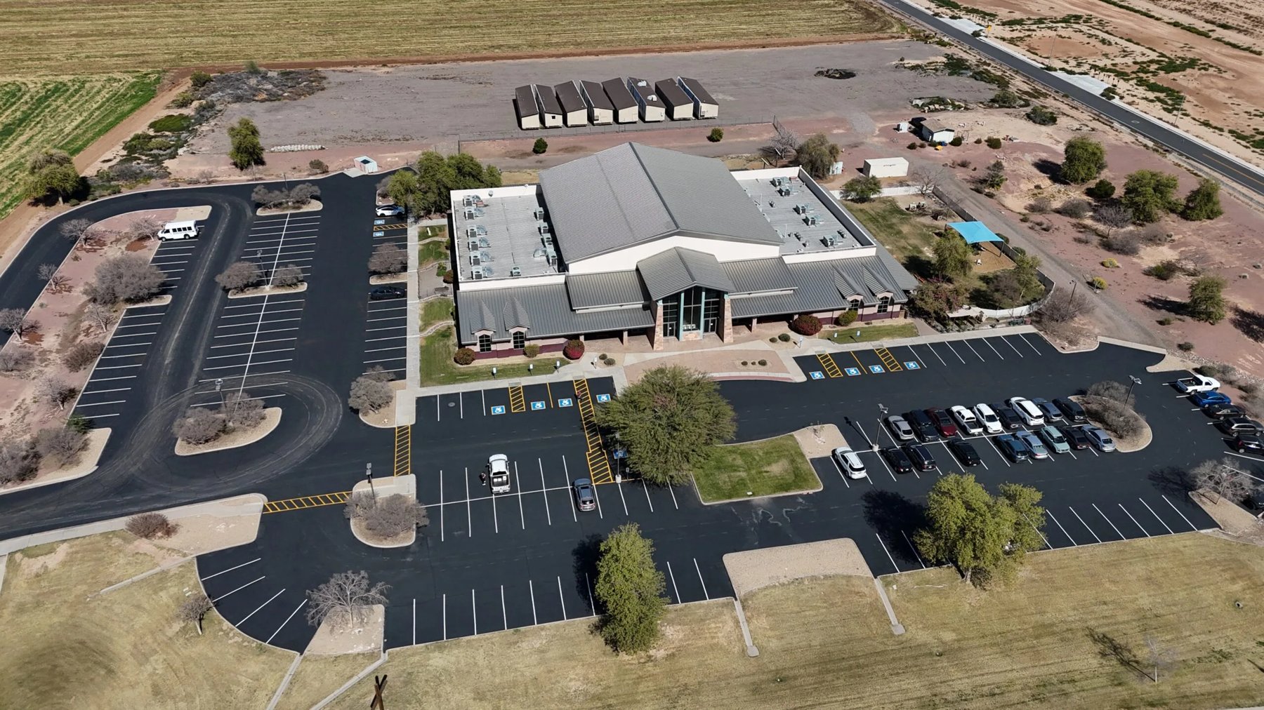 Aerial view of a freshly paved parking lot by Infinity Paving in Phoenix, AZ